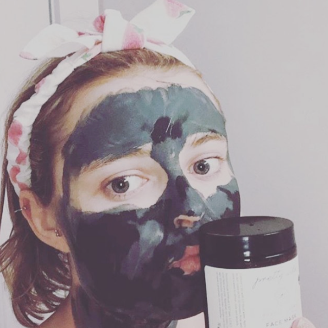 girl with a green clay mask on