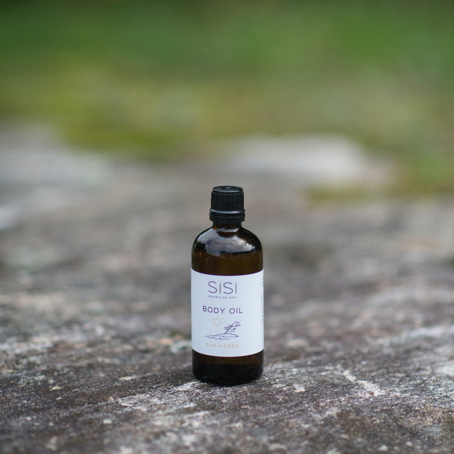 SiSi Georgian BAy Sunkissed natural body oil in an outdoor setting
