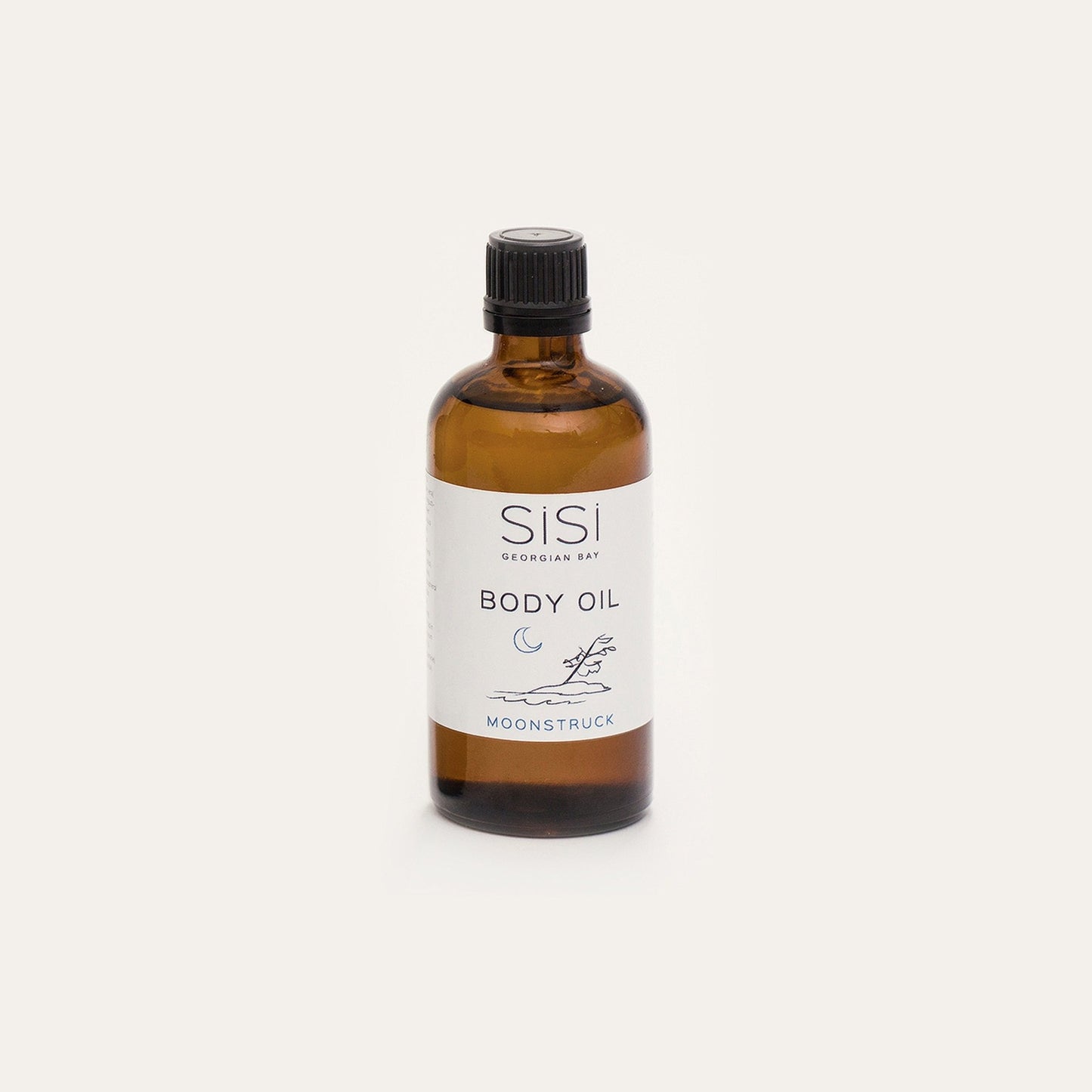 Moonstruck body oil in a 4oz amber glass bottle on a creamy white background