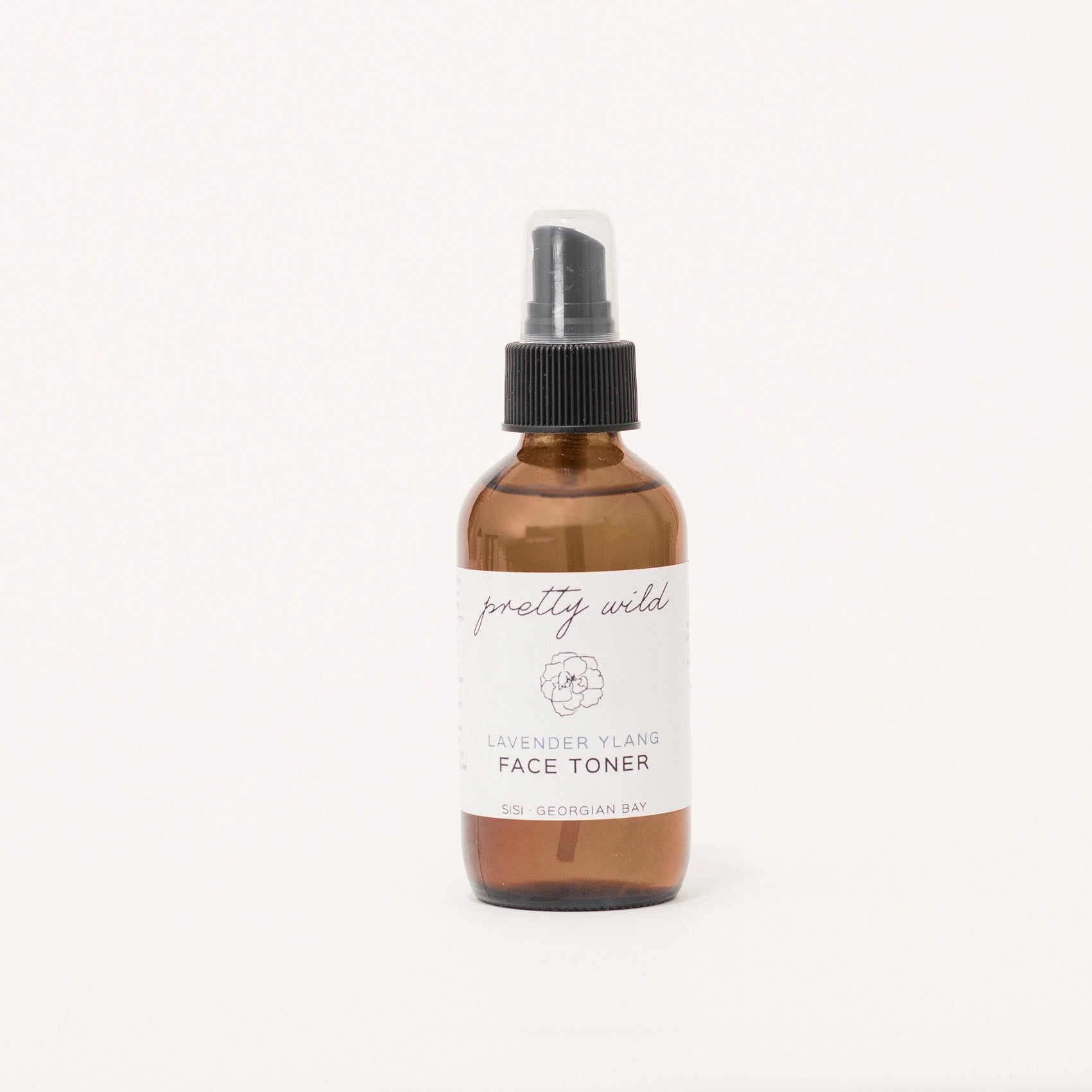 Natural face care routine - SiSi Georgian Bay "pretty wild" toners in an amber glass bottle with a mister lid on a creamy white background