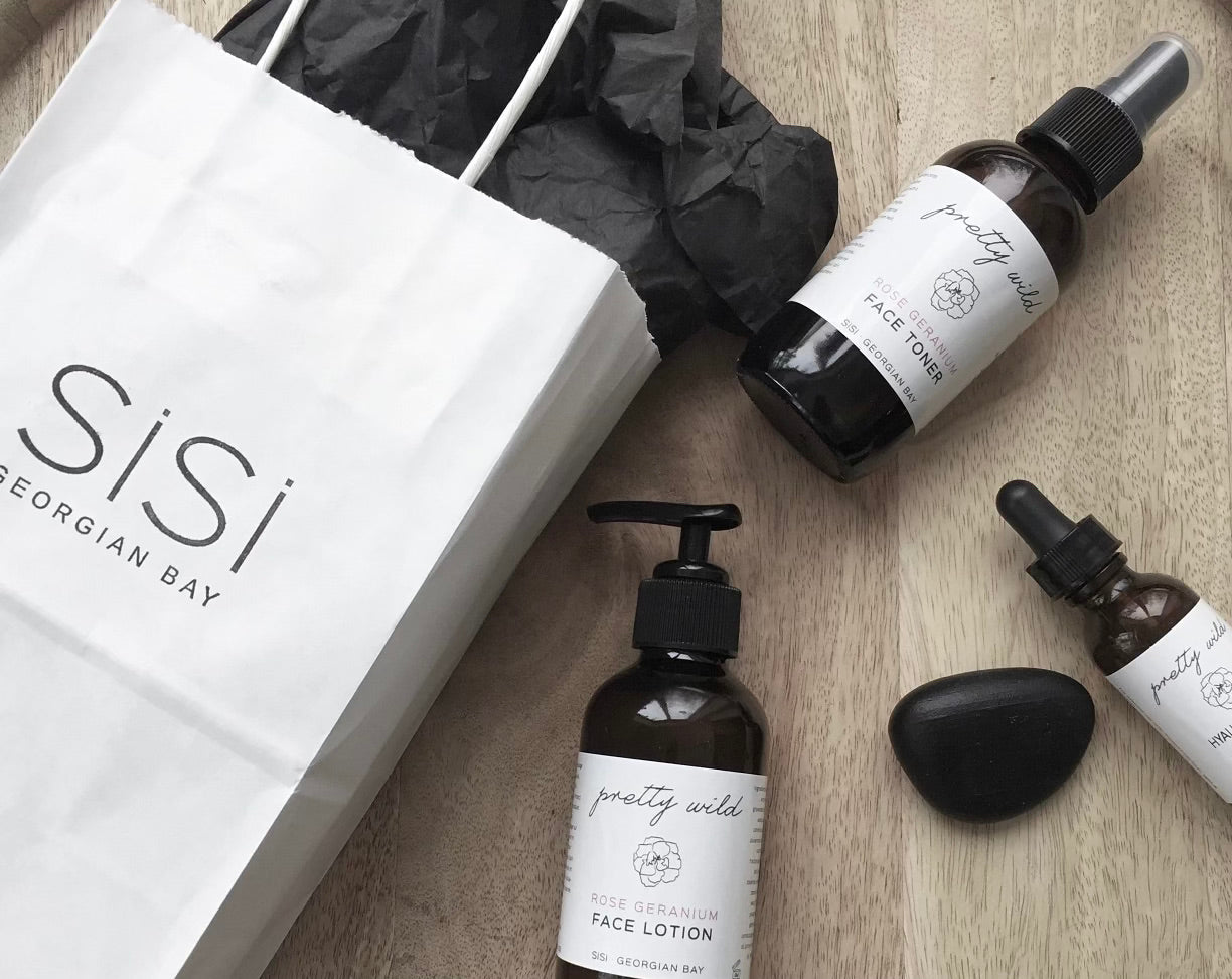 SiSi Georgian Bay Perfect Pair of pretty wild Face Cleanser and Face Lotion in amber glass bottles with black pump lids