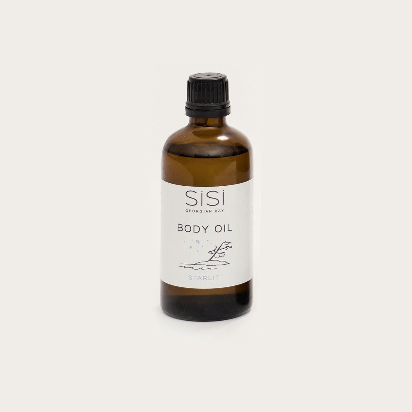 Starlit body oil in a 4oz amber glass bottle on a creamy white background