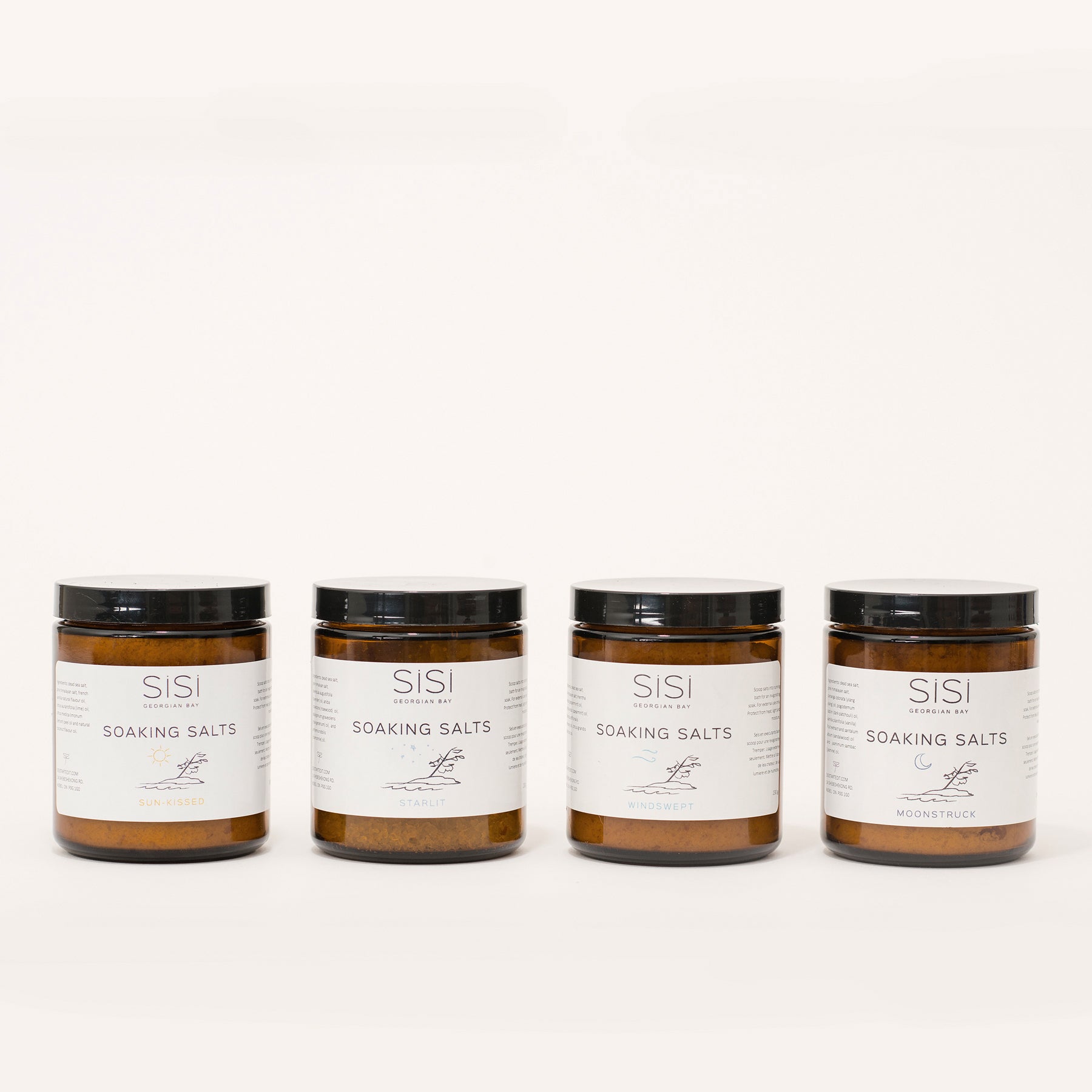 Natural skincare products - Apothecary Bath and Body Products - SiSi Georgian Bay Soaking Salts in amber glass jars with nature inspired artsy labels on a creamy white background